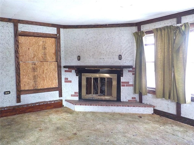 unfurnished living room with carpet floors and a brick fireplace