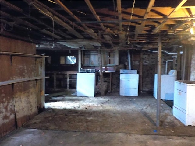 unfinished basement with washer and clothes dryer