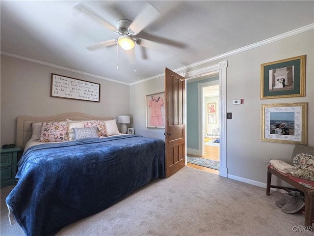 bedroom featuring baseboards, ceiling fan, carpet, and crown molding