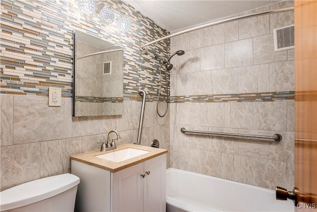 bathroom with toilet, shower / bathtub combination, visible vents, and vanity