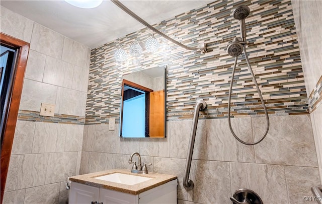 bathroom featuring tile walls and vanity