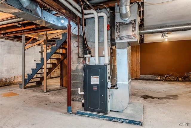 utility room featuring heating unit