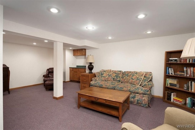 living area featuring baseboards, dark carpet, and recessed lighting