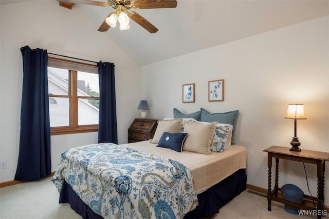 bedroom featuring lofted ceiling, light carpet, and baseboards