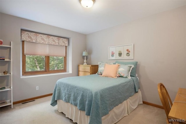 bedroom featuring light colored carpet, visible vents, and baseboards