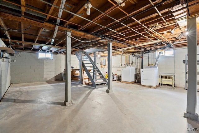 basement featuring stairway and washer and dryer