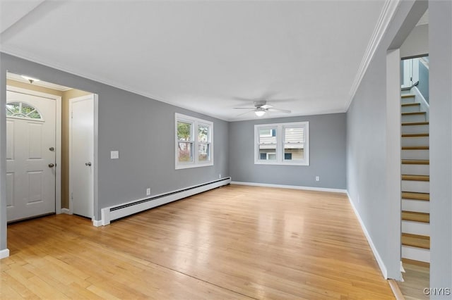 unfurnished living room with baseboards, ceiling fan, stairway, baseboard heating, and light wood-style floors