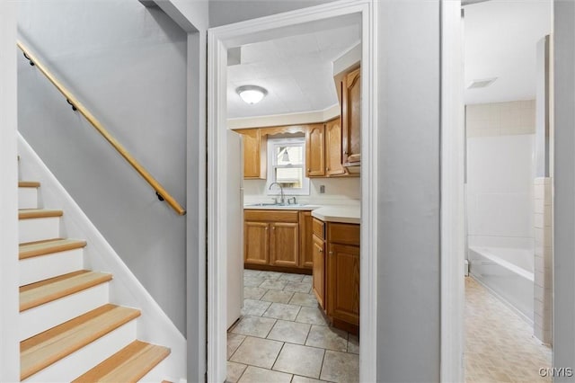 interior space featuring tile patterned floors, visible vents, and vanity