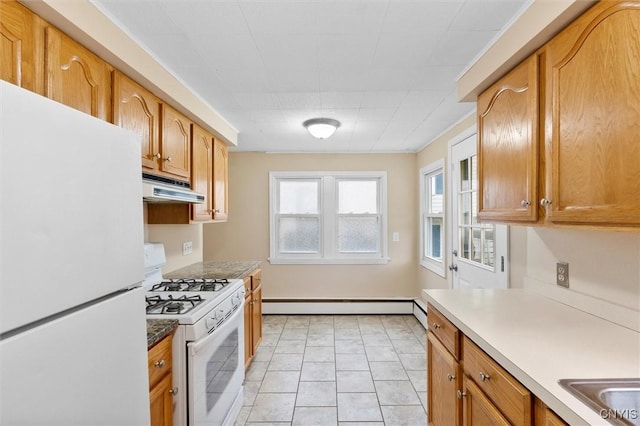 kitchen featuring white appliances, a baseboard radiator, under cabinet range hood, and brown cabinets