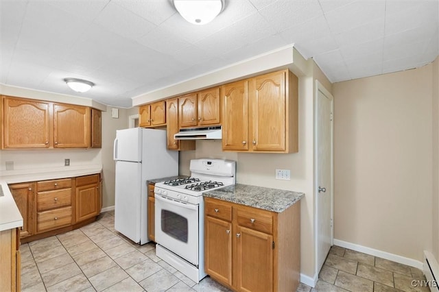 kitchen with a baseboard heating unit, light countertops, white appliances, and under cabinet range hood