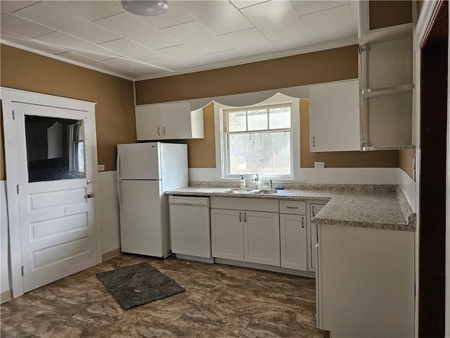 kitchen featuring white appliances, light countertops, white cabinetry, open shelves, and a sink