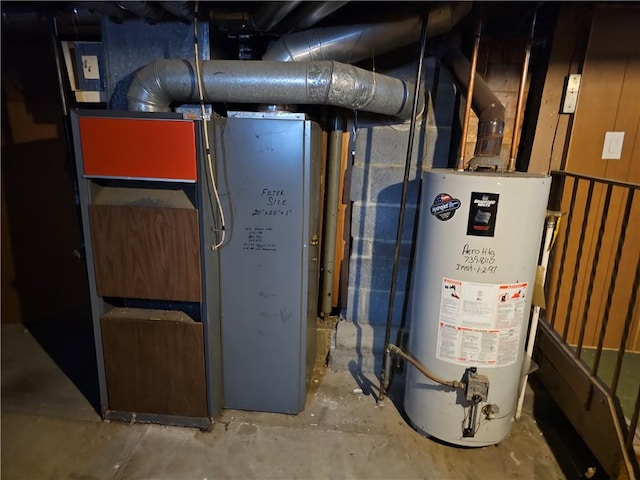 utility room featuring gas water heater