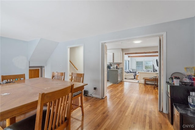 dining space featuring light wood finished floors