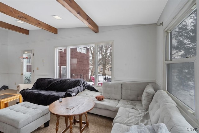 living room with beamed ceiling