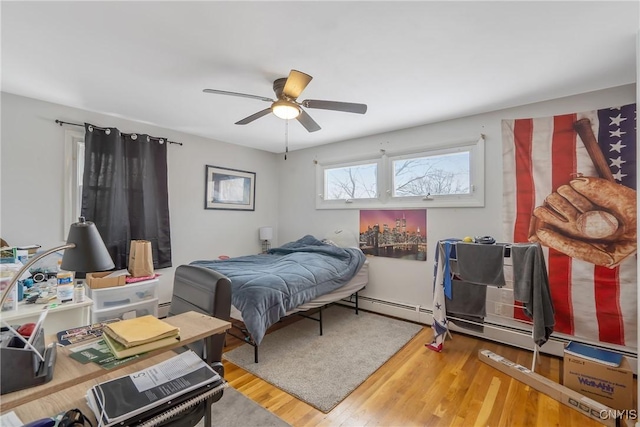 bedroom featuring wood finished floors and a ceiling fan