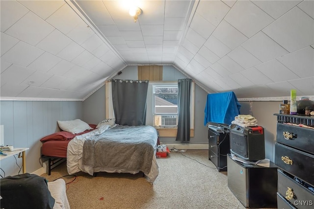 carpeted bedroom with lofted ceiling, a baseboard radiator, and cooling unit