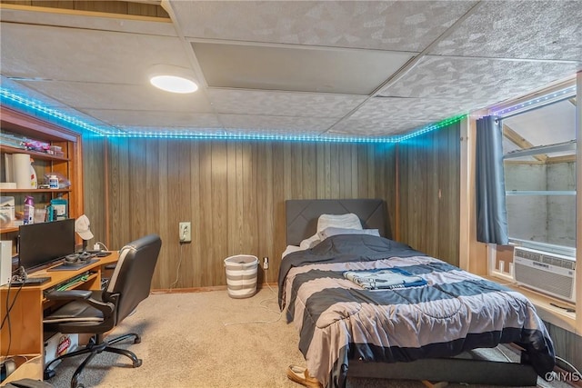 carpeted bedroom with cooling unit and wooden walls