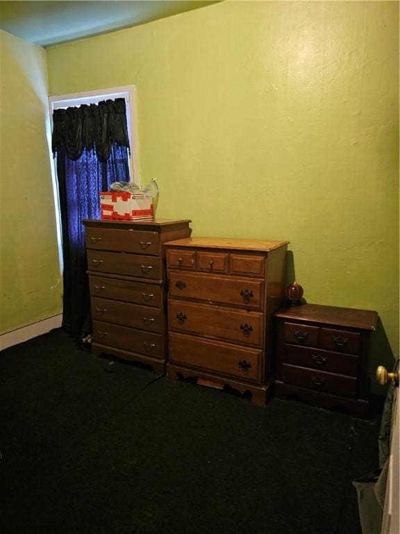 bedroom with dark carpet