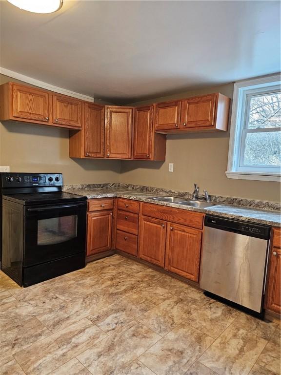 kitchen featuring dishwasher, electric range, brown cabinetry, and a sink