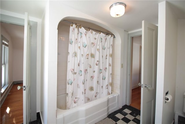 bathroom with visible vents and shower / bathtub combination with curtain