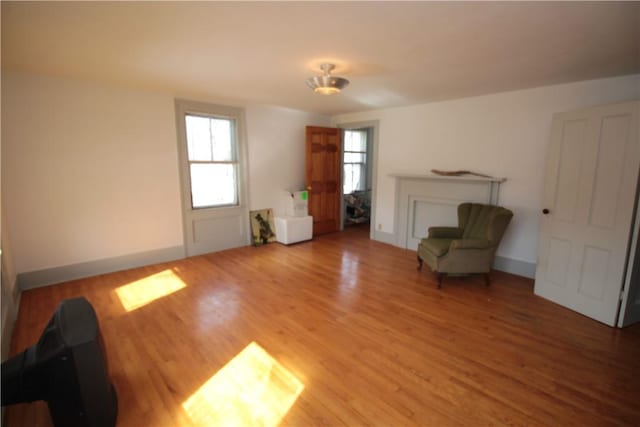 unfurnished room featuring wood finished floors and baseboards