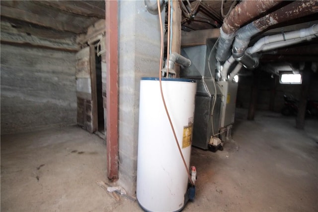 unfinished below grade area featuring water heater