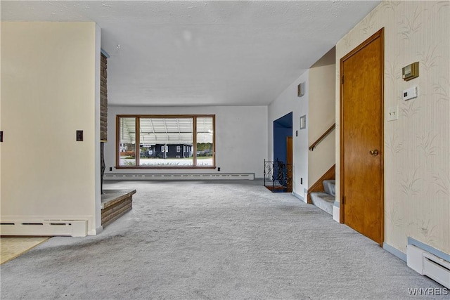 unfurnished living room with carpet floors, a baseboard radiator, stairway, and baseboard heating