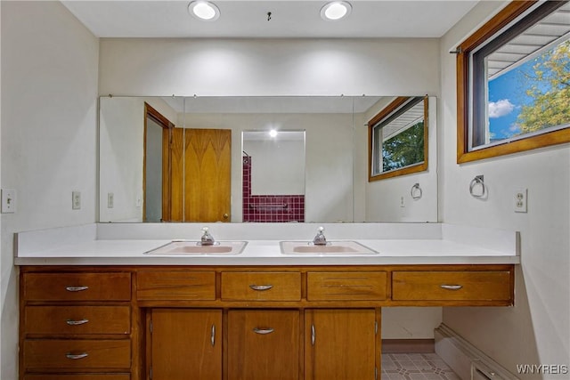 bathroom with double vanity and a sink