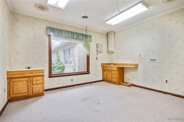 bathroom featuring visible vents, ornamental molding, vanity, a textured ceiling, and wallpapered walls