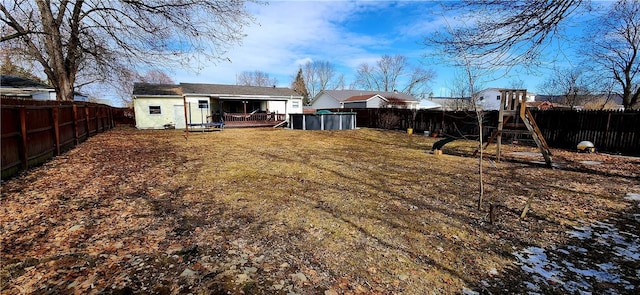 view of yard featuring a fenced backyard and an outdoor structure