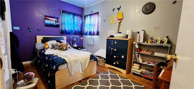 bedroom with wood finished floors