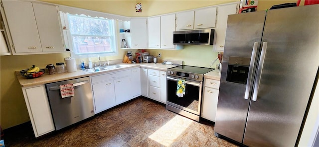 kitchen with stainless steel appliances, light countertops, white cabinetry, open shelves, and a sink