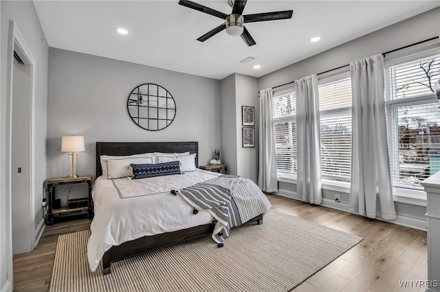 bedroom featuring recessed lighting, baseboards, and wood finished floors