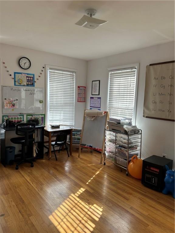 home office with wood finished floors