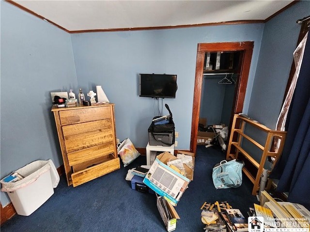 bedroom with crown molding and carpet flooring