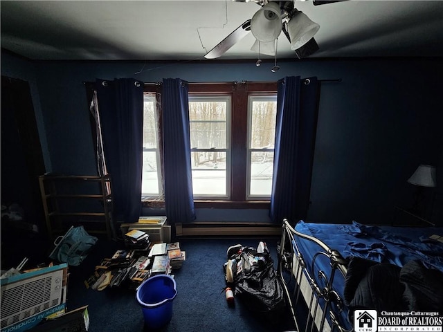 carpeted bedroom featuring ceiling fan and baseboard heating