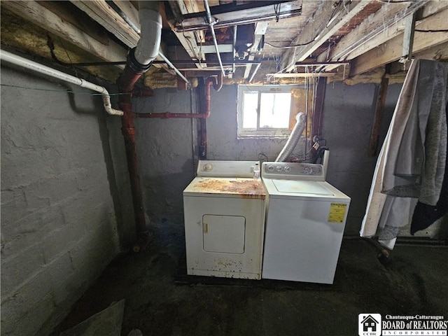 below grade area featuring washing machine and dryer