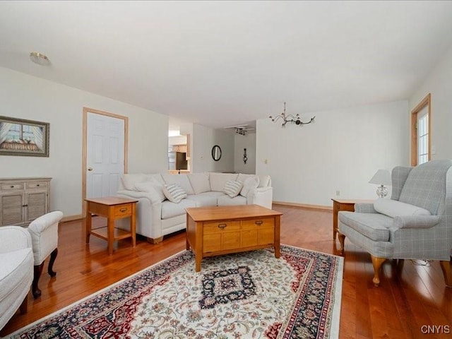 living room featuring wood finished floors and baseboards