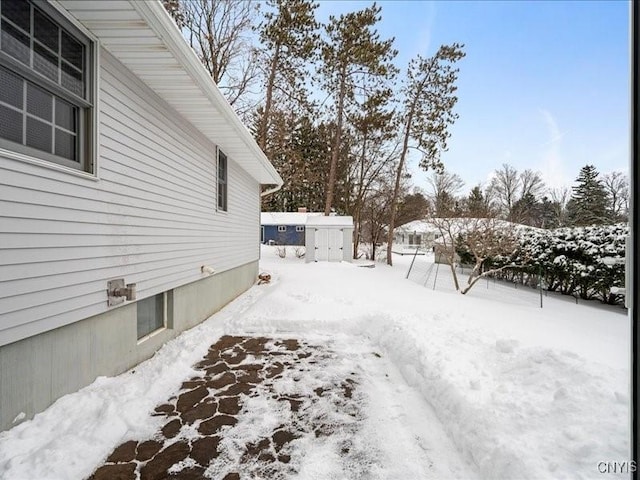 view of yard covered in snow