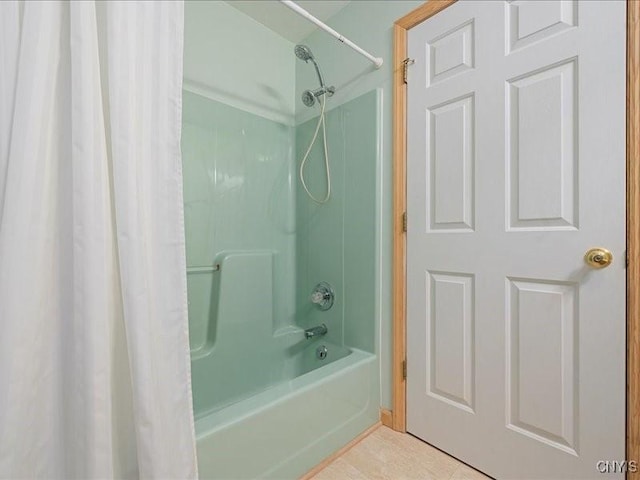 full bath featuring shower / tub combo and tile patterned floors