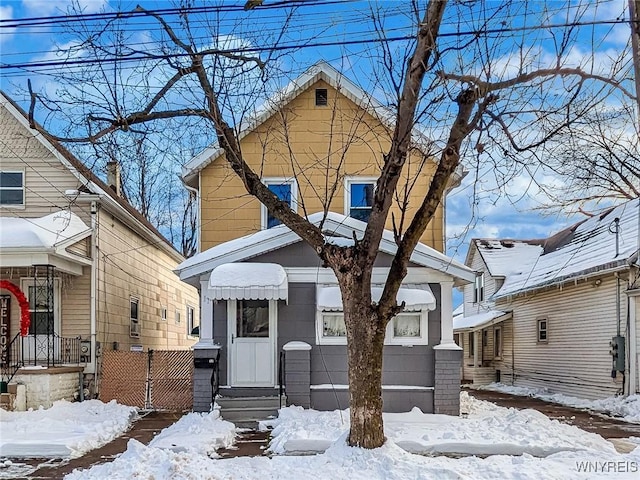 view of front of property featuring fence