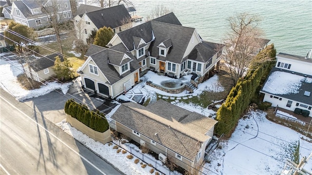 drone / aerial view featuring a water view and a residential view