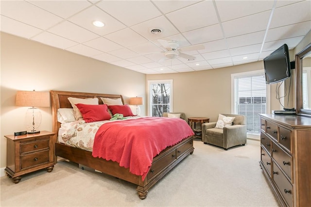 bedroom featuring recessed lighting, light colored carpet, visible vents, and multiple windows