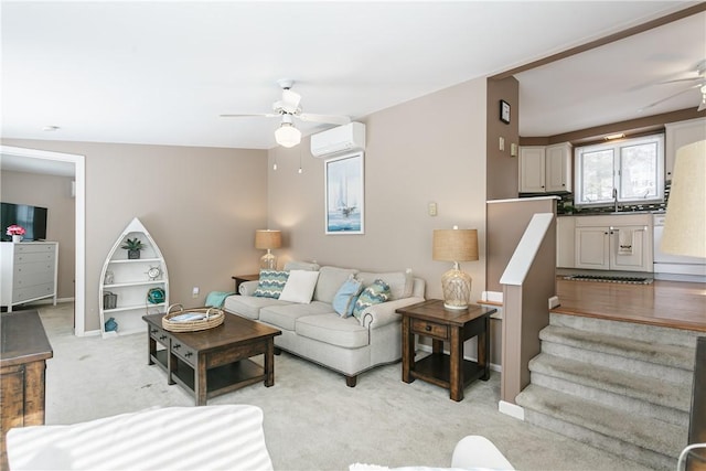 living room with baseboards, a ceiling fan, light colored carpet, stairway, and a wall mounted air conditioner