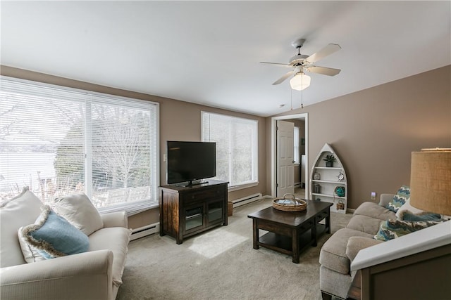 living room featuring light carpet, a baseboard radiator, and ceiling fan