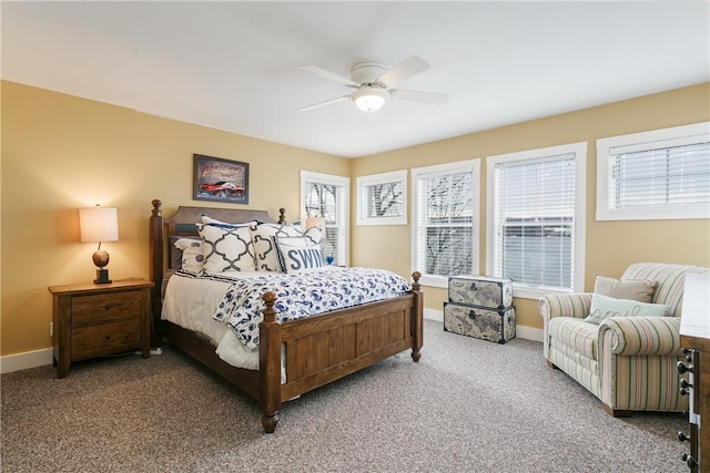 carpeted bedroom featuring ceiling fan and baseboards