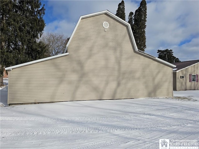 view of property exterior featuring a gambrel roof