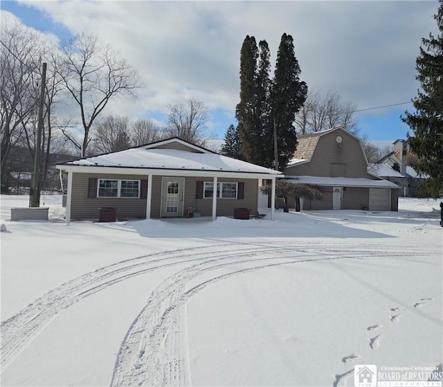 3963 Main St, Scio, NY 14880 - view of front facade with a barn, a garage, and an outbuilding