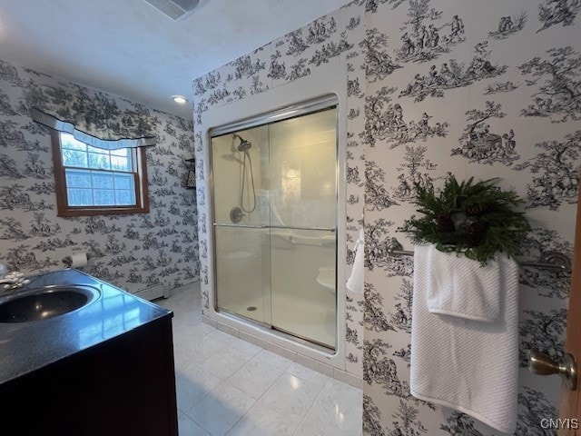 bathroom with tile patterned flooring, vanity, visible vents, a shower stall, and wallpapered walls