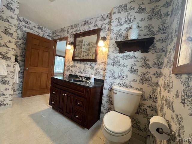 bathroom featuring tile patterned floors, vanity, toilet, and wallpapered walls